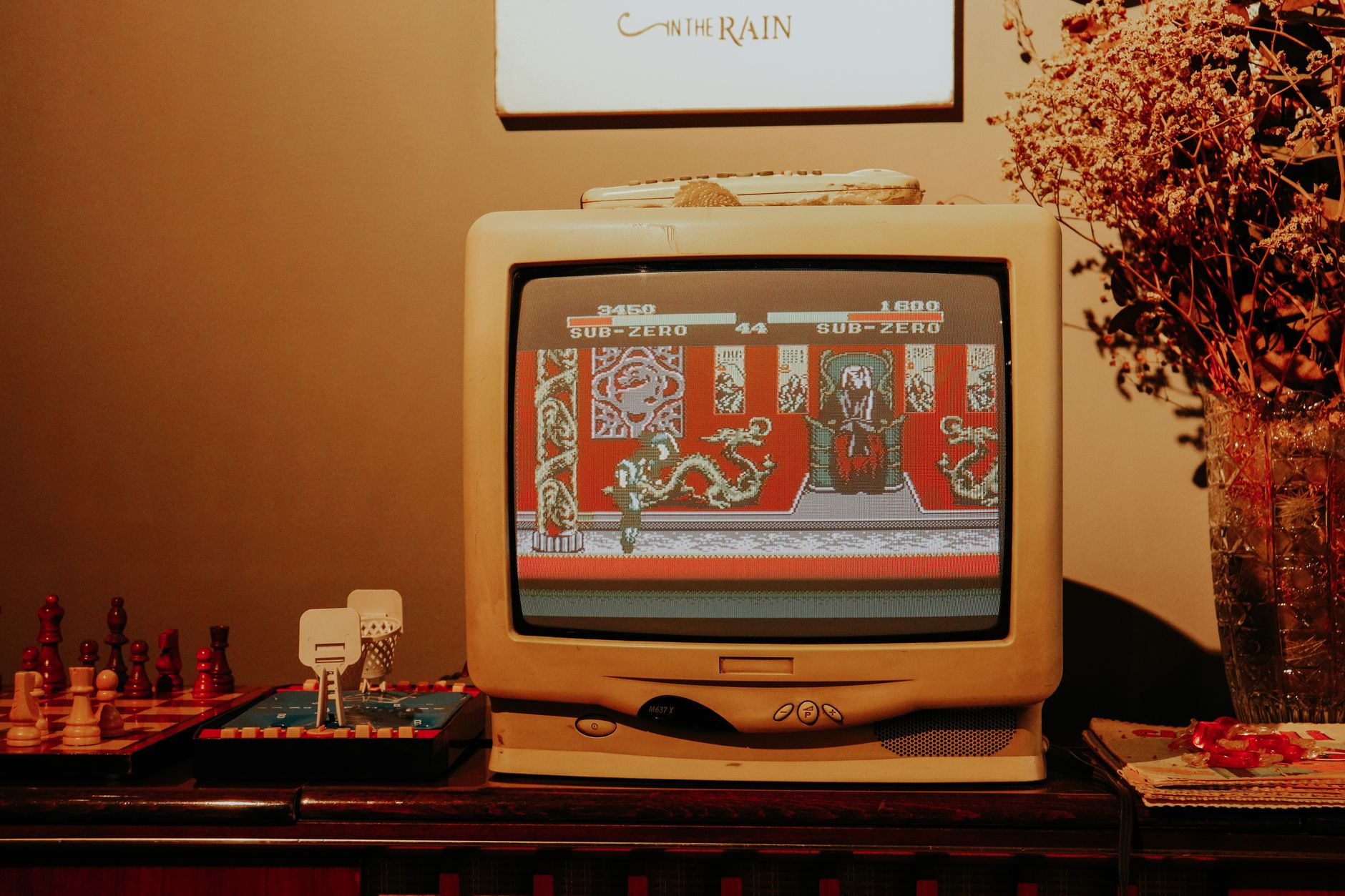 A retro game running on a CRT television on the bench